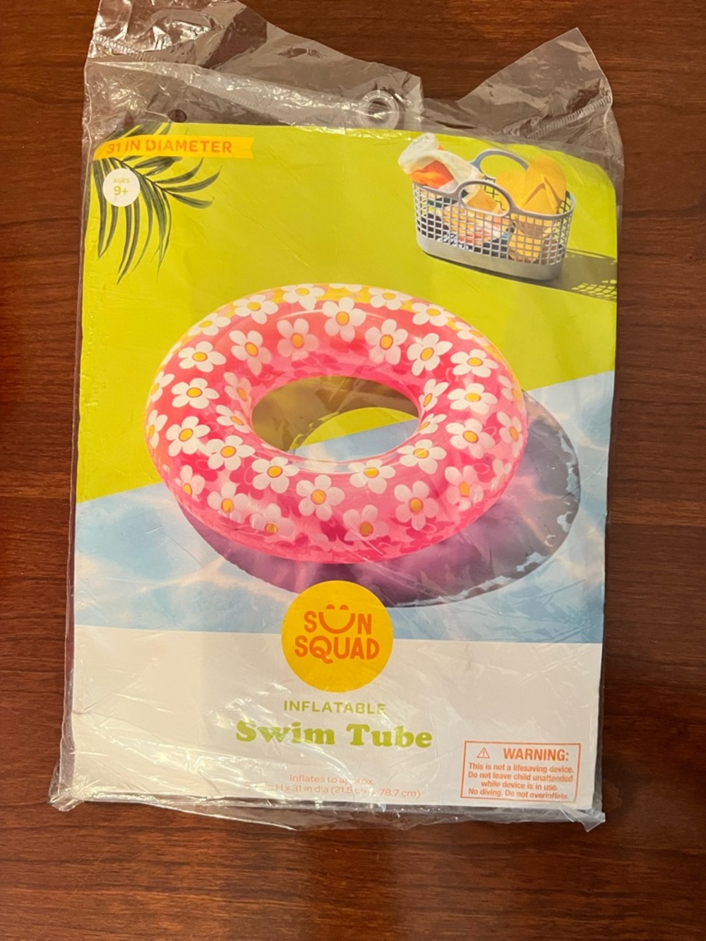 Pink Floral Inflatable Swim Tube with White and Yellow Flower Accents